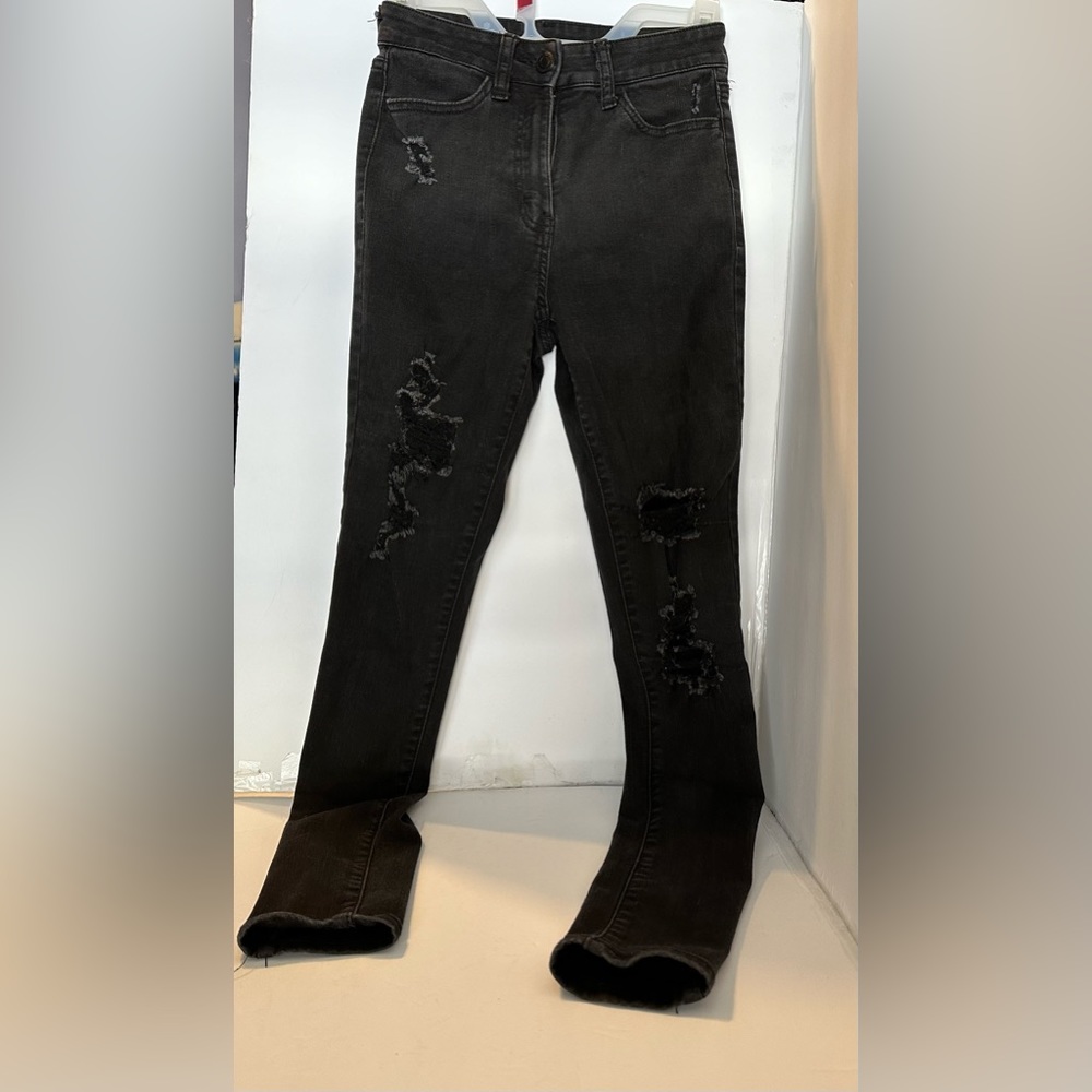 Black ripped jeans, brand is So and size is 3.